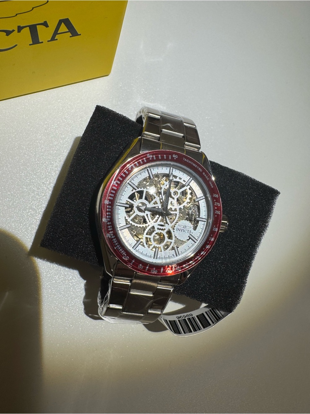 Invicta Silver Skeleton Watch with Red Bezel